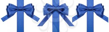 set of silk blue bows on vertical ribbons isolated on white background