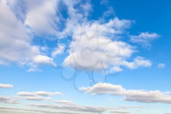 natural background - white stratus clouds in blue sky in autumn sunny day