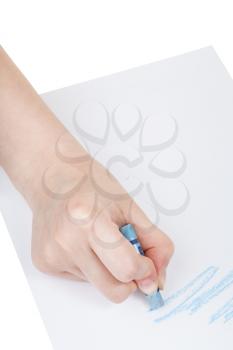 hand paints by blue chalk on sheet of paper isolated on white background