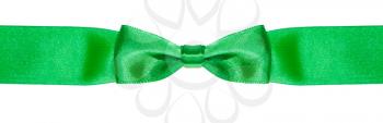 symmetric bow knot on narrow green satin ribbon isolated on white background