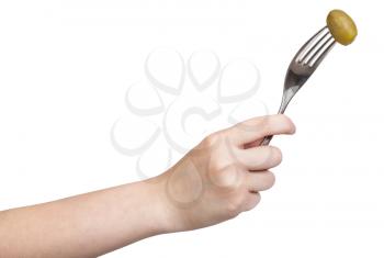 hand holding dinning fork with impaled green olive isolated on white background