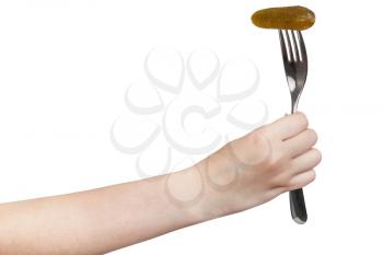 hand holds fork with impaled pickled gherkin isolated on white background