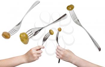set of dinning forks with green olive isolated on white background