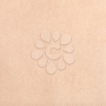 textured square background from brown crumpled kraft paper