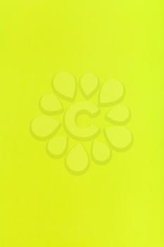 vertical background from lemon yellow colored sheet of paper