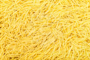 food background - many durum wheat semolina pasta filini