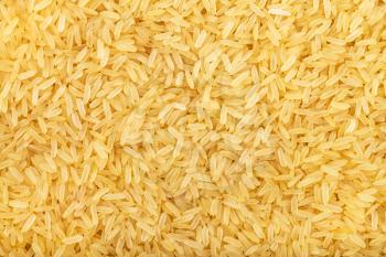 food background - yellow parboiled long-grain Indica rice