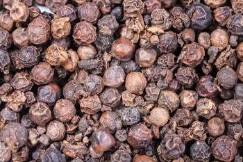 food background - many dried Black pepper peppercorns