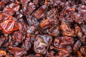food background - dried red berberis fruits close up