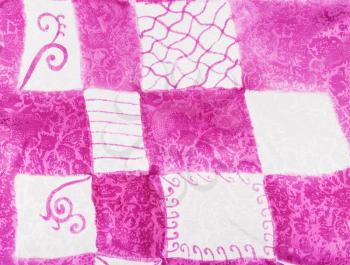 textile background - abstract hand painted pink and white square ornament on silk batik
