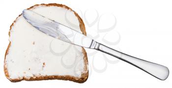 grain bread and Cheese spread sandwich with table knife isolated on white background
