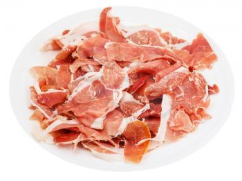 thin sliced dry-cured jamon on white plate isolated on white background