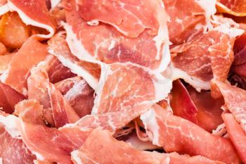 food background - thin slices of jamon close up