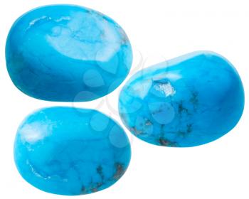 natural mineral gem stone - three turkvenit (blue howlite) gemstones isolated on white background close up