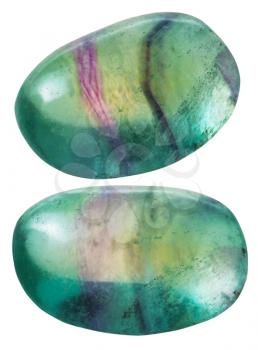 natural mineral gem stone - two green Fluorite (fluorspar) gemstones isolated on white background close up