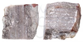 macro shooting of specimen natural rock - two pieces of Rhyolite mineral stone isolated on white background