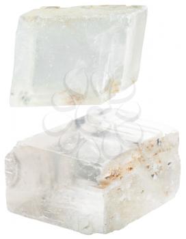 macro shooting of collection natural rock - two transparent iceland spar mineral gem stones isolated on white background