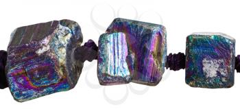 three beads from iridescent (rainbow) pyrite gem stones close up isolated on white background