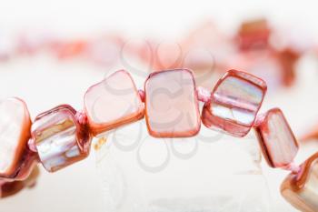 necklace from pink nacre gem stones close up