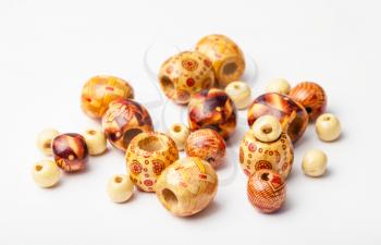 set of painted natural wood beads close up