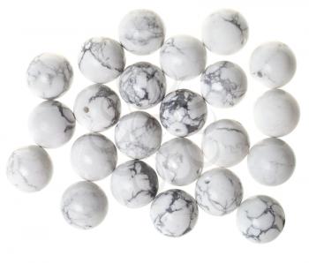 top view of many beads from white howlite gemstone on white background