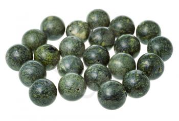 many beads from green serpentine gemstone on white background