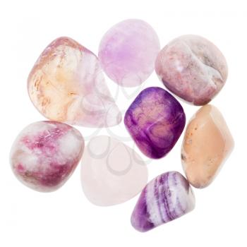 pile of pink and violet natural mineral gemstones isolated on white background