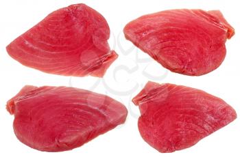four slices of raw tuna fish meat isolated on white background