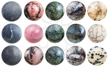 set of polished balls from shungite, rhodonite, labradorite, aplite ( dalmatian jasper), serpentine, cacholong (milky white opal), anhydrite natural mineral gem stone isolated on white background