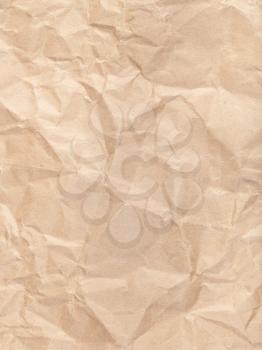 vertical background from brown colour crumpled paper