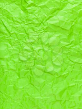 vertical background from green colour crumpled paper