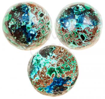 macro shooting of natural mineral stone - three balls from chrysocolla with cuprite gemstone isolated on white background
