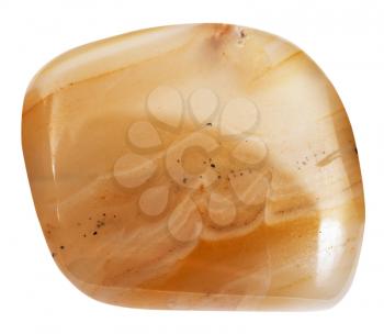 macro shooting of natural mineral stone - polished banded yellow agate (chalcedony) gemstone isolated on white background