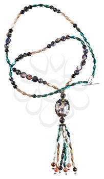 necklace from glass beads and polished pieces of nacre mollusk shells and abalon gems isolated on white background