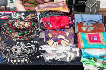 table with accessories, jewelry, bags, scarves at the fair