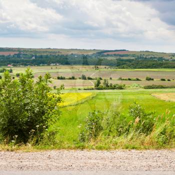 country landscape with road, fields and village, Kuban, Russia