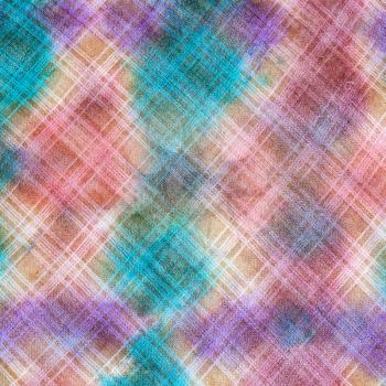 textile background - hand painted checkered pattern on linen batik fabric close up