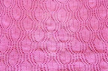 background from pink fabric hand-knitted with cotton thread