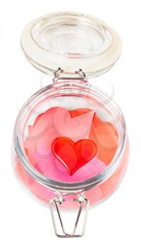 above view of one glass heart on pile of paper hearts in open jar isolated on white background