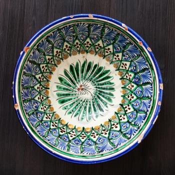 above view of typical central asian bowl on dark brown table