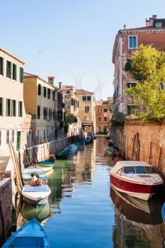 travel to Italy - moorindg boats in canal in Cannaregio sestieri (district) in Venice city