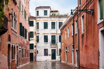 travel to Italy - wet street in Venice city in rainy autumn day
