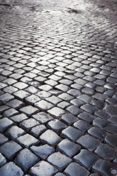travel to Italy - paving stone road in medieval district of Rome city