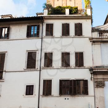travel to Italy - white facades of urban houses in medieval district of Rome city