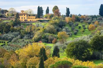 travel to Italy - above view of green and yellow gardens in Florence neighborhood from Piazzale Michelangelo in Florence city in autumn
