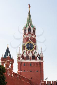 travel to Russia - Spasskaya Tower with clock in Kremlin in Moscow in evening
