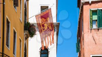 travel to Italy - flag of Venetian Republic (Most Serene Republic) on urban house in Venice city