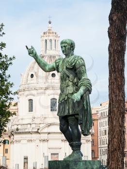 Travel to Italy - bronze statue of emperor on Fori Imperiali on Roman forum in Rome city in winter