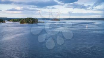 panorama of Baltic Sea with green islands in fiord in autumn evening, Sweden