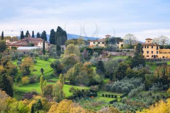 travel to Italy - above view of green and yellow gardens in suburb of Florence city from Piazzale Michelangelo in Florence city in autumn